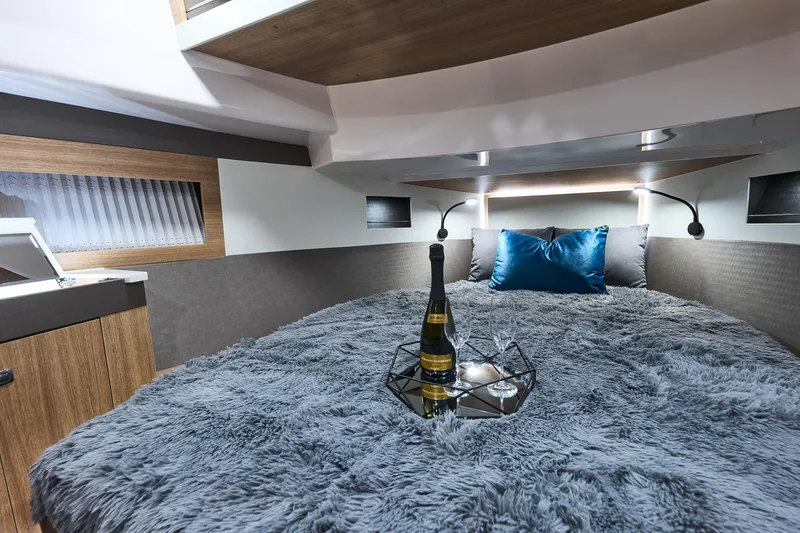 Slide: The Image of Luxurious Northman 1300 yacht interior with cozy bed, champagne, and elegant decor, 2025 model. - 45