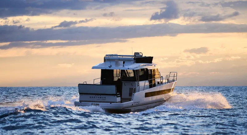 Slide: The Image of 2025 Northman 1300 yacht cruising at sunset on open sea. - 33