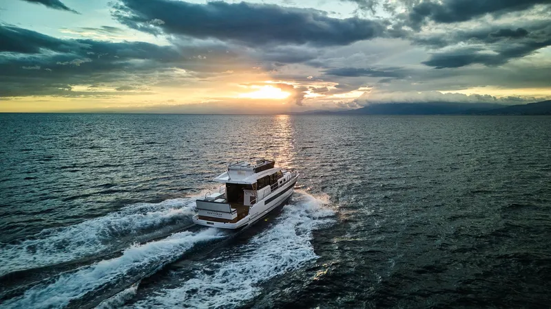 Slide: The Image of Northman 1300 yacht cruising at sunset, 2025 model, on open sea. - 34