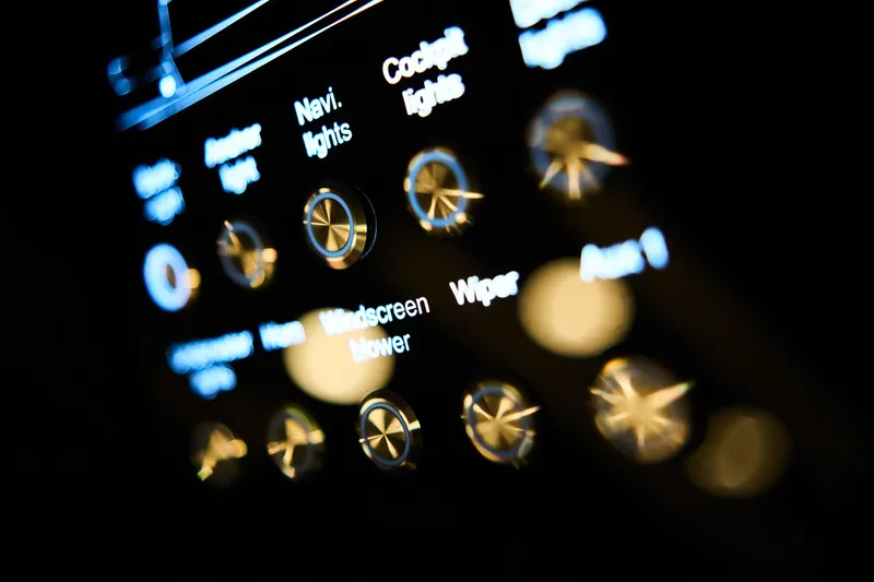 Slide: The Image of Close-up of illuminated control panel in 2025 Northman 1300, featuring various labeled buttons and dials. - 48