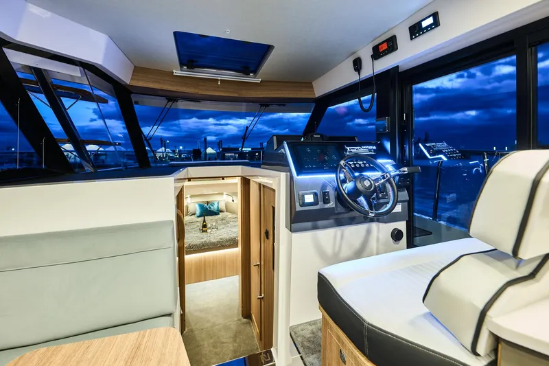 Slide: The Image of Luxurious interior of 2025 Northman 1300 yacht with modern helm and cozy cabin. - 38