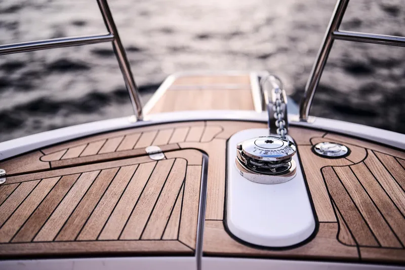 Slide: The Image of Deck of 2025 Northman 1300 yacht with wooden finish and metal fittings. - 30