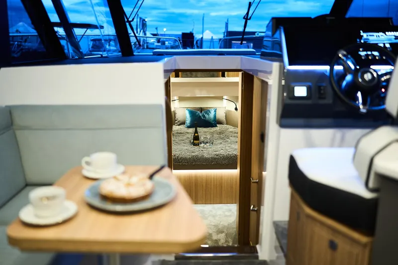 Slide: The Image of Luxurious interior of 2025 Northman 1300 yacht with cozy cabin and dining area. - 35