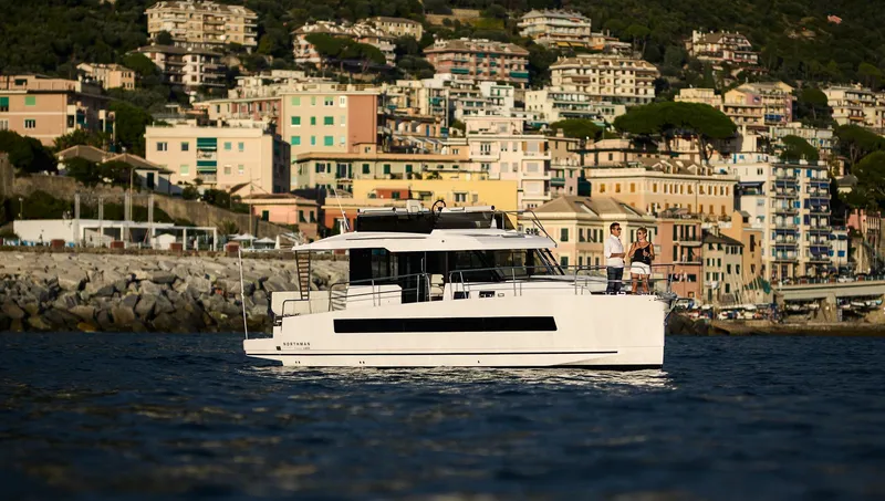 Slide: The Image of 2025 Northman 1300 yacht cruising near colorful coastal town buildings. - 4
