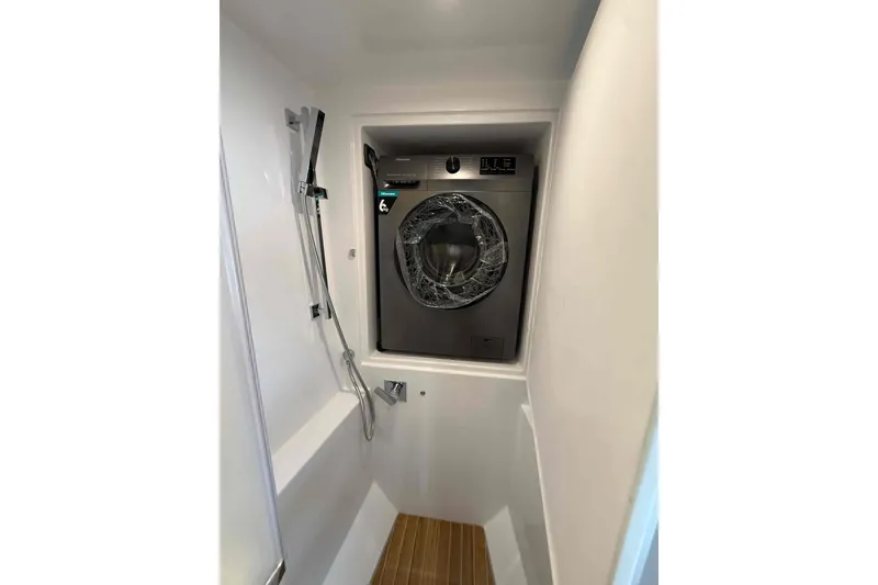 Slide: The Image of Laundry area with washer in 2026 Aventura 37 Explorer Trawler bathroom. - 18