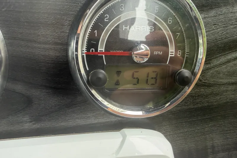 Slide: The Image of Close-up of 2023 Harris Sunliner 230 RPM gauge displaying 513 hours. - 11