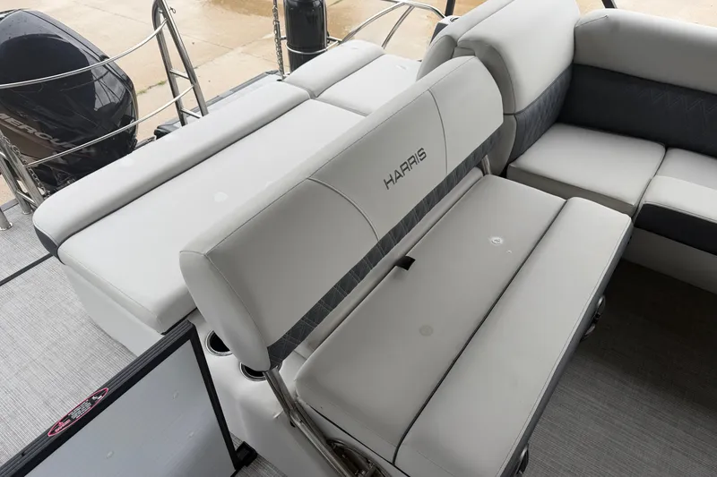 Slide: The Image of 2023 Harris Sunliner 230 boat interior with plush seating and modern design. - 15