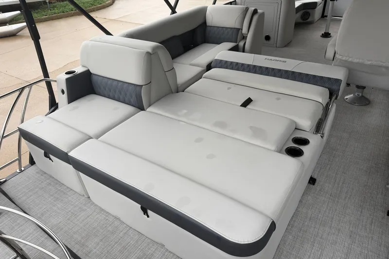 Slide: The Image of Luxurious seating on 2023 Harris Sunliner 230 pontoon boat with cup holders and modern design. - 18