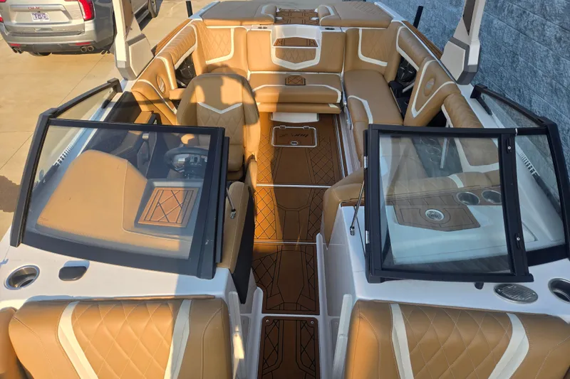 Slide: The Image of 2020 Tigé 23ZX boat interior with tan leather seating and modern design. - 16