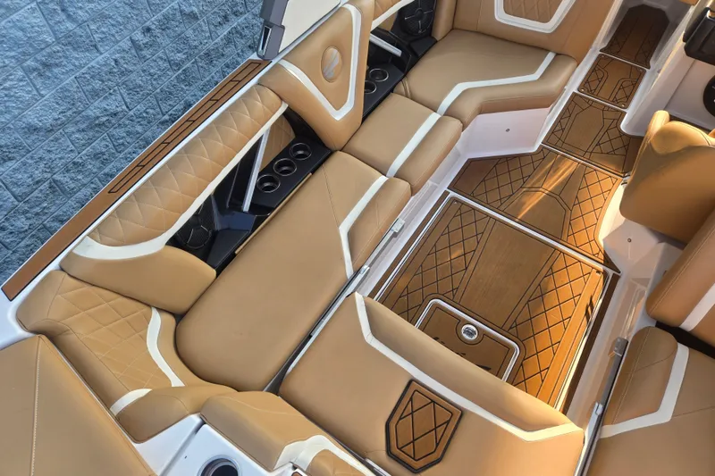 Slide: The Image of Luxurious interior of 2020 Tigé 23ZX boat with tan leather seating and stylish flooring. - 8
