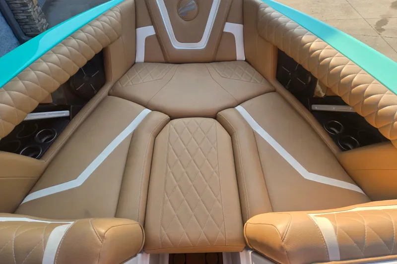 Slide: The Image of Luxurious interior of 2020 Tigé 23ZX boat with tan quilted seating. - 13