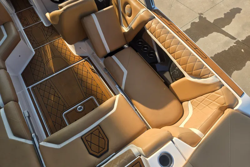 Slide: The Image of Luxurious interior of 2020 Tigé 23ZX boat with tan leather seating and stylish flooring. - 7