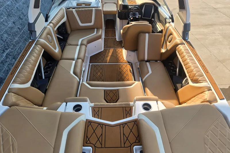 Slide: The Image of Luxurious interior of 2020 Tigé 23ZX boat with tan leather seating and modern design. - 4