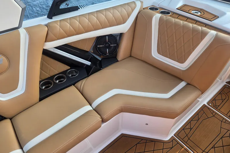 Slide: The Image of Luxurious interior of 2020 Tigé 23ZX boat with tan and white seating. - 9