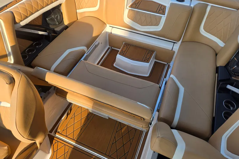 Slide: The Image of Luxurious interior of 2020 Tigé 23ZX boat with tan leather seating and stylish design. - 17