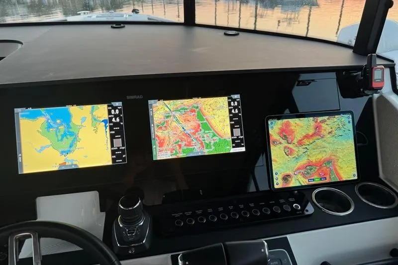 Slide: The Image of Dashboard of 2025 Saxdor 320 GTC with navigation screens and controls. - 27