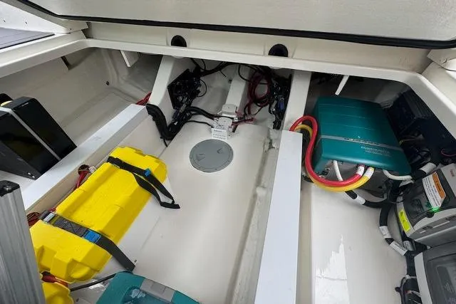 Slide: The Image of Interior view of 2025 Saxdor 320 GTC boat engine compartment with wiring and components. - 40