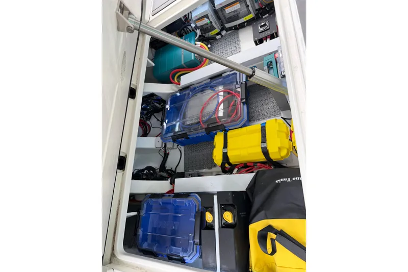 Slide: The Image of Storage compartment of 2025 Saxdor 320 GTC boat with organized equipment and gear. - 38