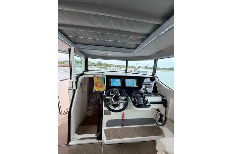 Slide: The Image of Interior cockpit of 2025 Saxdor 320 GTC boat with advanced navigation displays. - 26