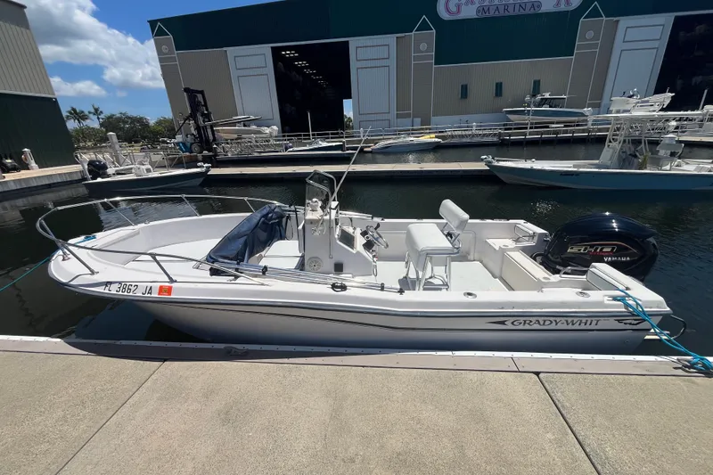 Slide: The Image of 1994 Grady-White Escape 209 boat docked at marina with Yamaha engine. - 21