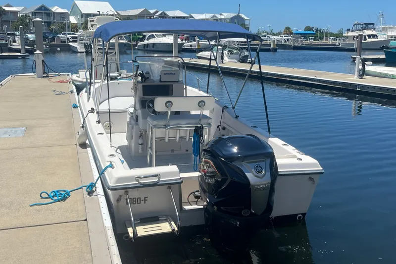 Slide: The Image of 1994 Grady-White Escape 209 boat docked at marina with Yamaha outboard motor. - 6