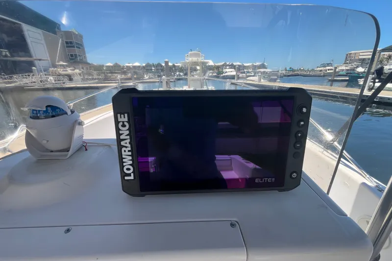 Slide: The Image of Lowrance Elite GPS on 1994 Grady-White Escape 209 boat at marina. - 17