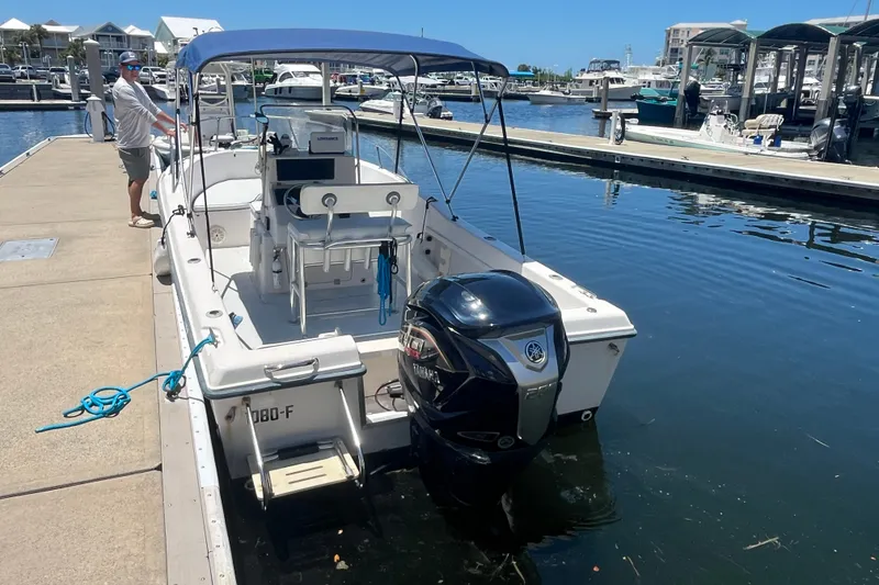 Slide: The Image of 1994 Grady-White Escape 209 boat docked at marina with Yamaha outboard motor. - 20