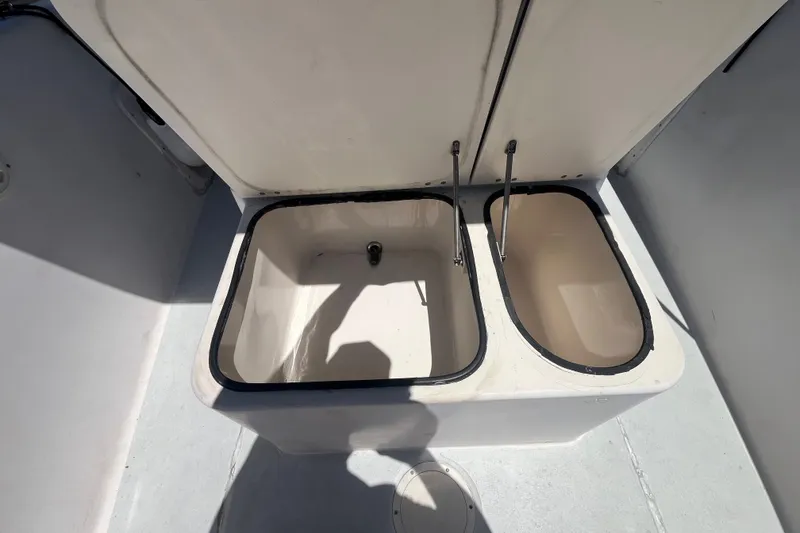 Slide: The Image of Open storage compartments on a 1994 Grady-White Escape 209 boat deck. - 13