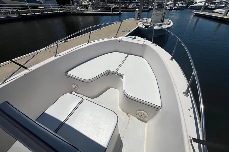 Slide: The Image of 1994 Grady-White Escape 209 boat interior with seating, docked at marina. - 9