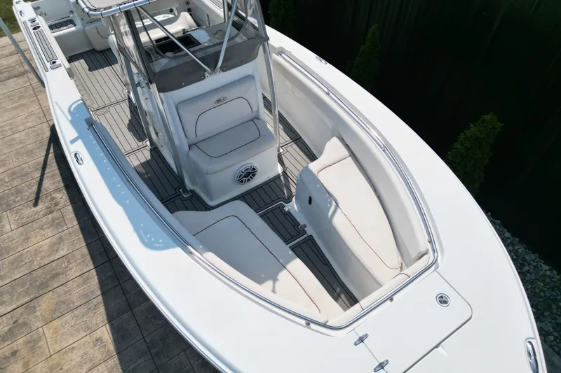 Slide: The Image of 2008 Sea Hunt Triton 260 boat interior with seating and console, viewed from above. - 14