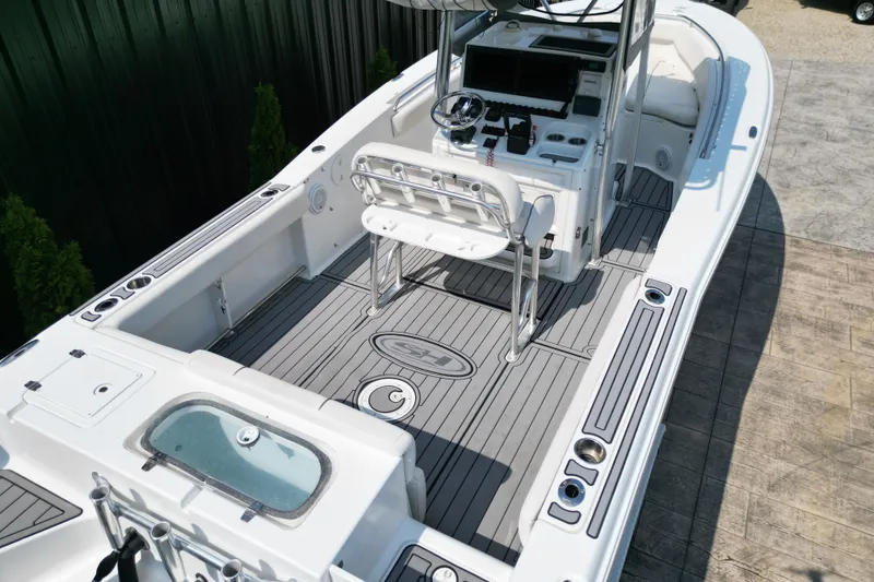 Slide: The Image of 2008 Sea Hunt Triton 260 boat interior with helm, seating, and deck features. - 5