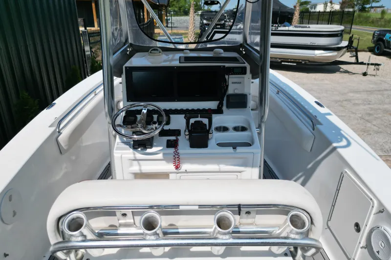 Slide: The Image of 2008 Sea Hunt Triton 260 boat console with steering wheel and navigation equipment. - 7