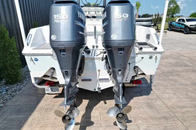 Slide: The Image of 2008 Sea Hunt Triton 260 with twin Yamaha 150 outboard motors. - 8