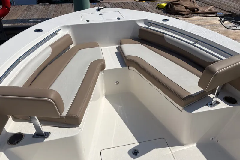 Slide: The Image of 2024 Sea Born LX24 Center Console boat interior with cushioned seating. - 6