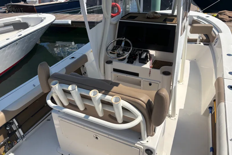 Slide: The Image of 2024 Sea Born LX24 Center Console boat interior with helm and seating. - 11