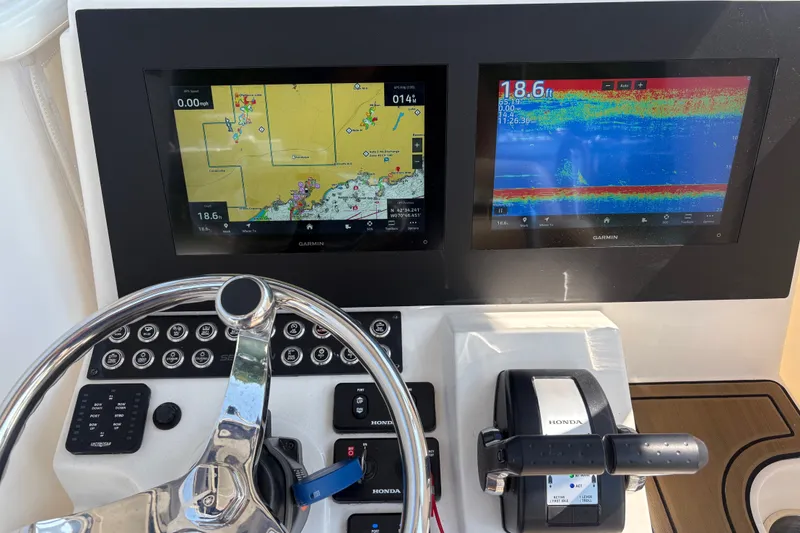 Slide: The Image of 2024 Sea Born LX24 Center Console dashboard with Garmin navigation displays. - 4