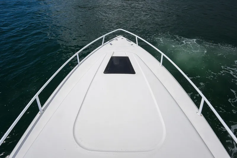 Slide: The Image of Bow view of a 2009 Intrepid 370 boat cruising on open water. - 5