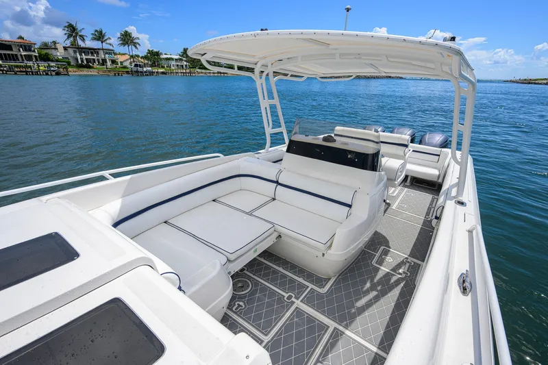 Slide: The Image of 2009 Intrepid 370 boat with spacious seating on a sunny day by the water. - 15