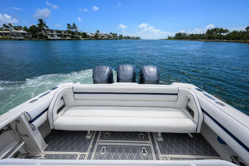 Slide: The Image of Intrepid 370 boat, 2009 model, with triple engines cruising on a sunny day. - 17
