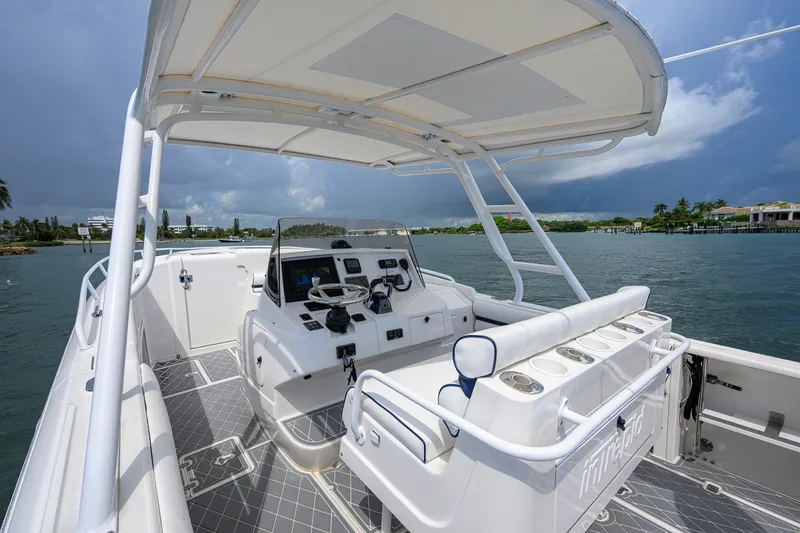 Slide: The Image of 2009 Intrepid 370 boat interior with helm, seating, and ocean view. - 11