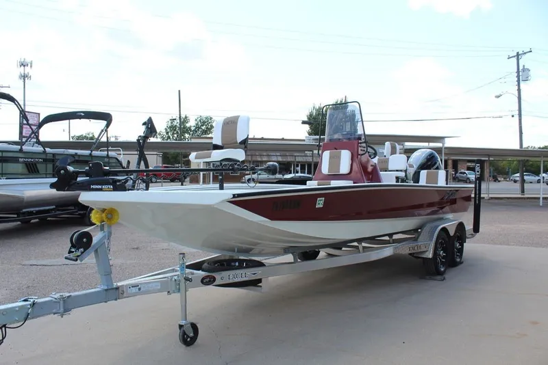 Slide: The Image of 2025 Excel 220 Bay Pro Elite boat on trailer, featuring sleek design and modern equipment. - 15