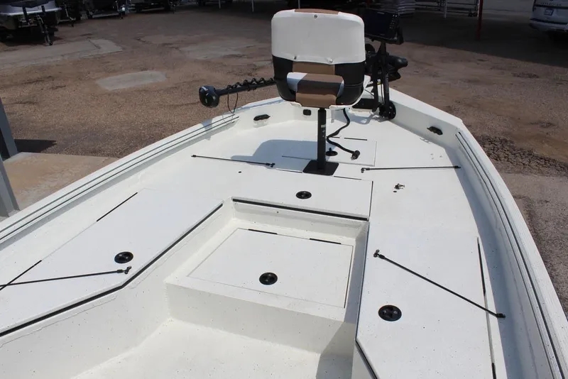 Slide: The Image of 2025 Excel 220 Bay Pro Elite boat with seating and storage compartments. - 16