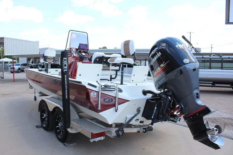 Slide: The Image of 2025 Excel 220 Bay Pro Elite boat with Yamaha outboard motor on trailer. - 7