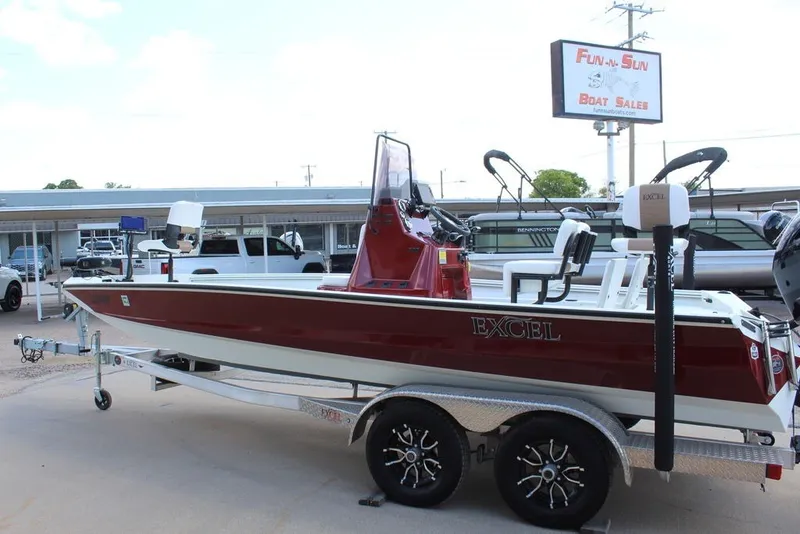 Slide: The Image of 2025 Excel 220 Bay Pro Elite boat on trailer at dealership. - 9