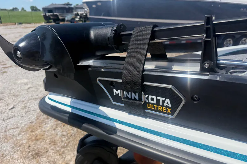 Slide: The Image of Minn Kota Ultrex motor on 2027 Phoenix 720 ZXL boat, outdoor setting. - 7
