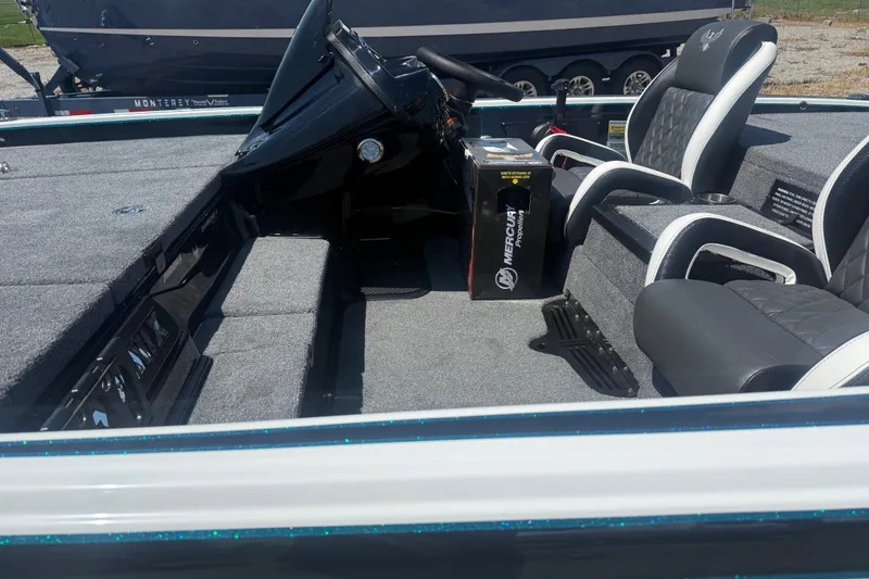 Slide: The Image of Interior of a 2027 Phoenix 720 ZXL boat with seating and Mercury propeller box. - 9