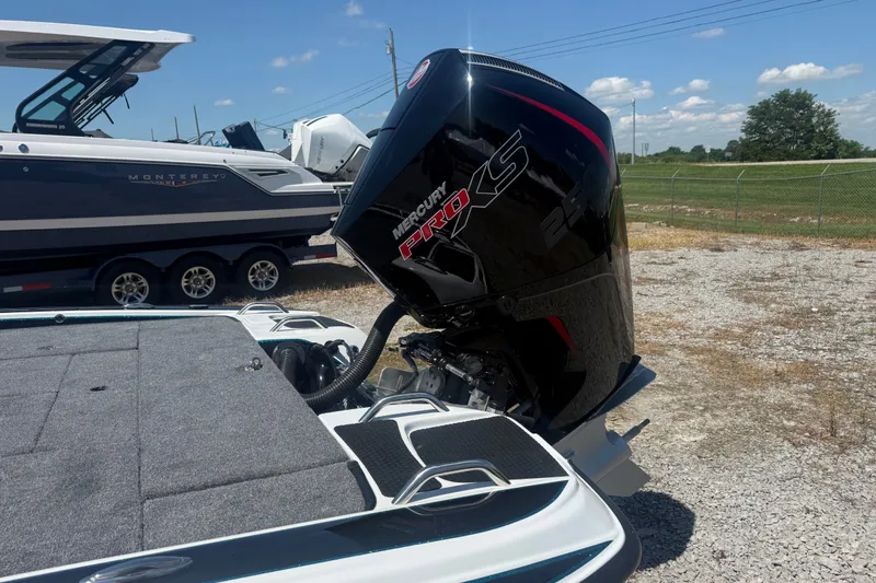 Slide: The Image of 2027 Phoenix 720 ZXL boat with Mercury Pro XS engine in outdoor setting. - 12