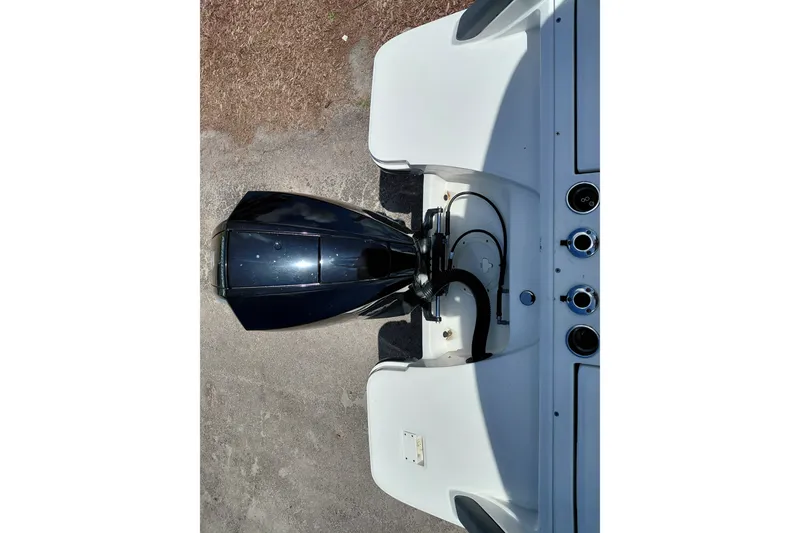 Slide: The Image of Top view of a 2020 Bayliner Trophy T20CC boat engine and controls. - 28