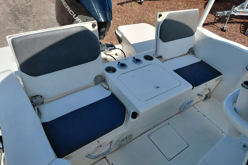 Slide: The Image of 2020 Bayliner Trophy T20CC boat interior with seating and storage compartments. - 23