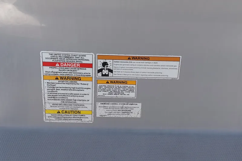 Slide: The Image of Safety warning labels on 2020 Bayliner Trophy T20CC boat, highlighting dangers and precautions. - 18